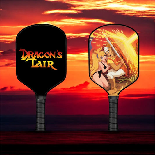 Pickleball paddle pair with Dragon's Lair logo and colorful character face graphics