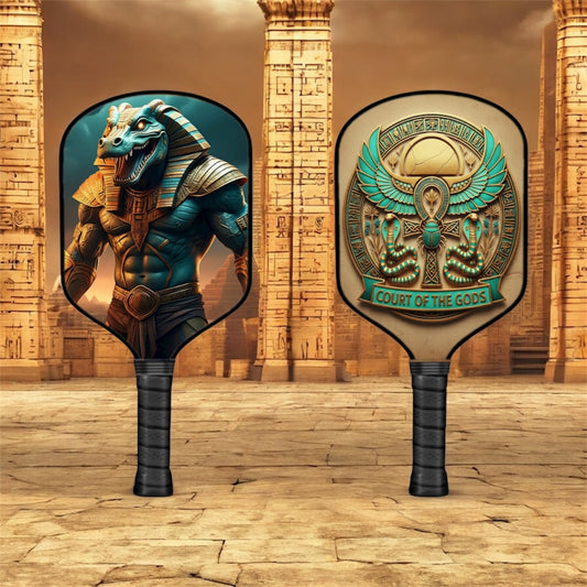 Pickleball paddle with teal Sobek graphic on round face and dark textured handle