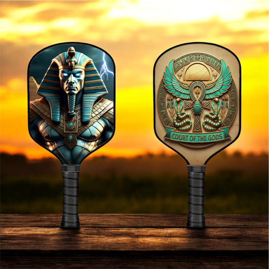 Amun pickleball paddle with blue-gold Egyptian face graphic on dark paddle face