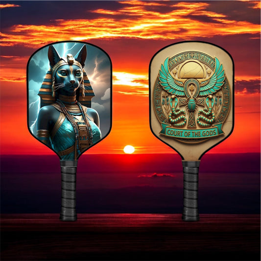Pickleball paddle with blue and green Bastet goddess graphic on oval face