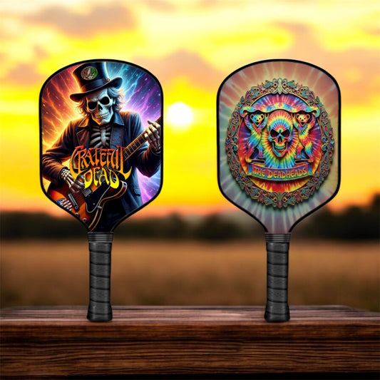 Pickleball paddle set with black paddles and colorful skull guitar artwork