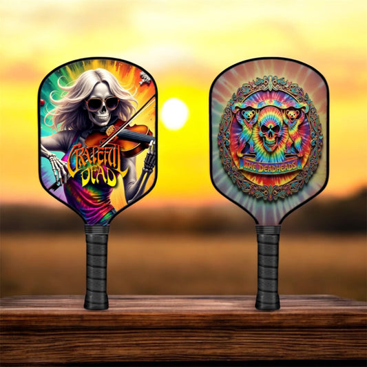 Pickleball paddle with colorful skull violin graphic on round paddle face and black handle