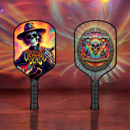 Pickleball paddle with colorful skull and bear artwork, black grip and face