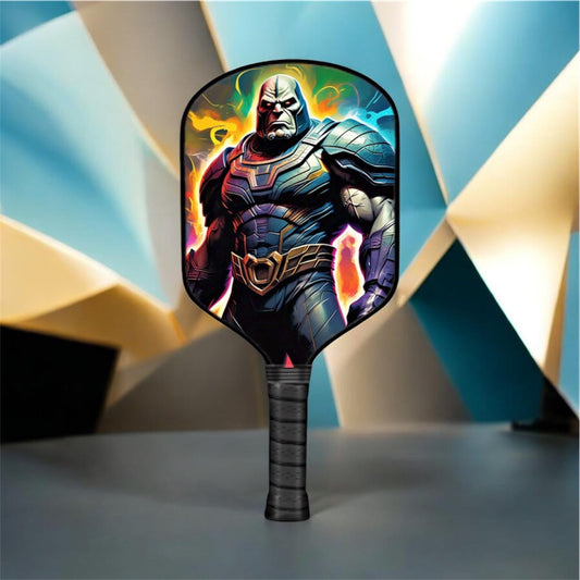 Pickleball paddle with colorful comic-style face and black textured grip, round head