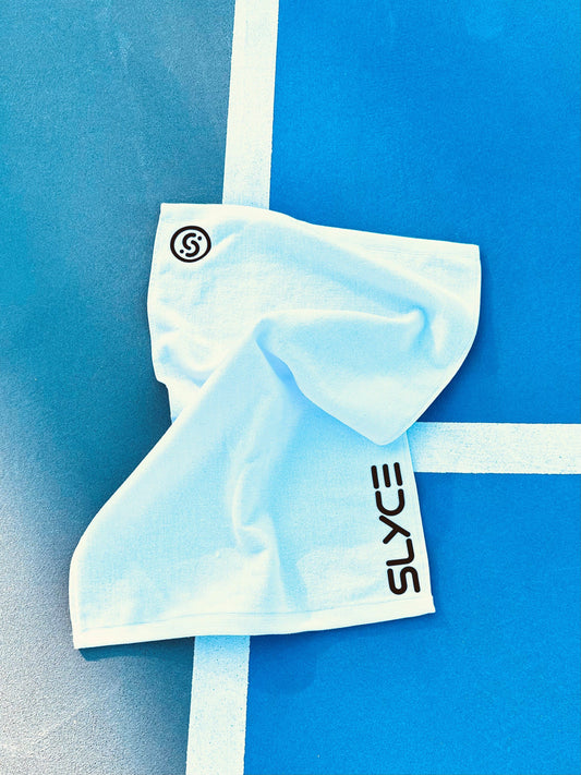 Folded SLYCE players towel in light blue with vertical SLYCE logo