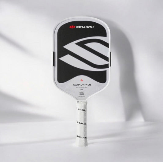 Elongated pickleball paddle with black face and white logo graphics, gray grip handle