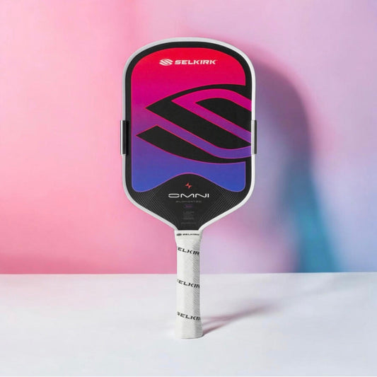 Selkirk OMNI pickleball paddle with red, purple, and black face and dark edge guard