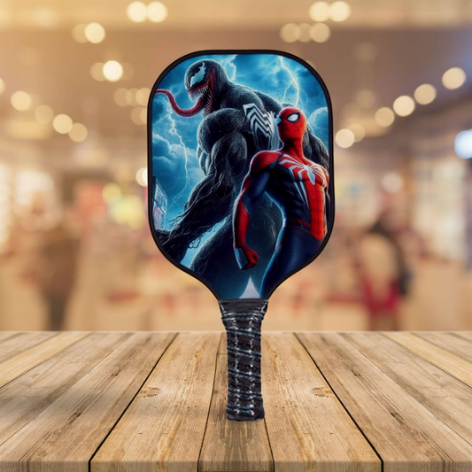 Pickleball paddle with Spider-Man and Venom artwork, dark blue face and black grip