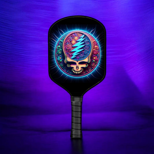 Neon graphic pickleball paddle with skull emblem on black face