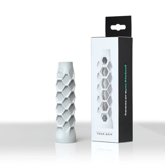 White pickleball grip sleeve with hex honeycomb texture, cushioned cross pattern