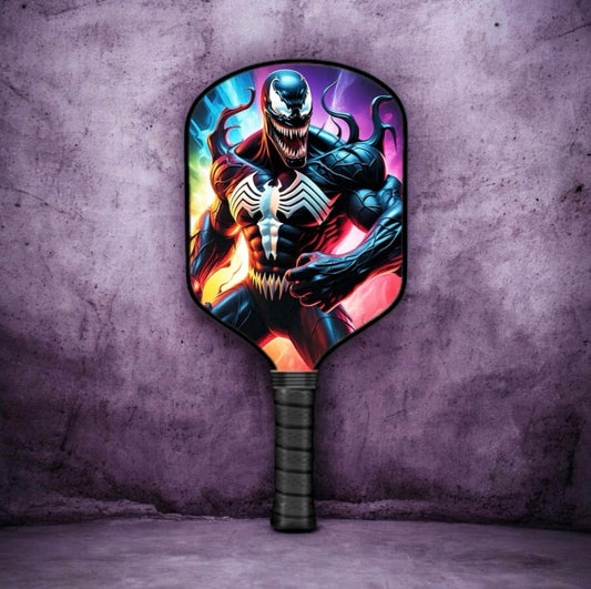 Venom-themed pickleball paddle with circular face, black grip, fiery character graphic