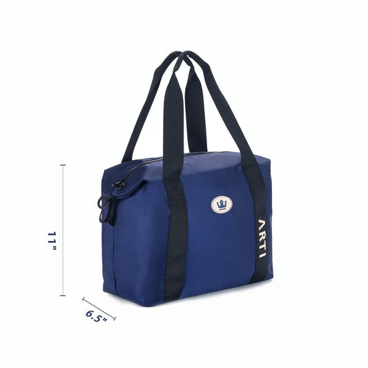Navy duffle bag with black strap handles, side zipper pocket, and ARTI label