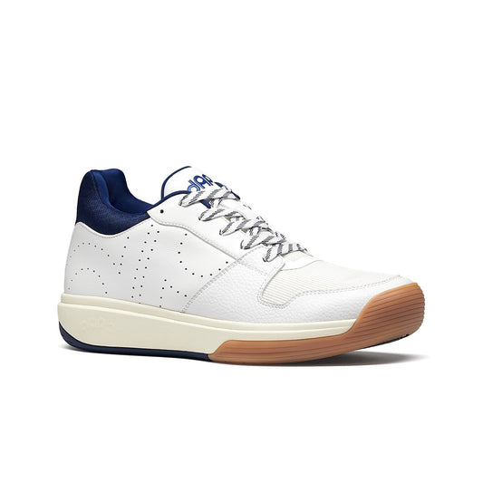 Navy and white mid-top pickleball shoes with lace-up closure and tan rubber outsole