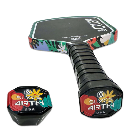 Pickleball paddle grip end cap with black handle sleeve and multicolor floral top.