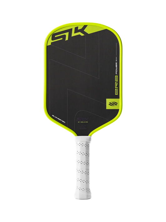 Elongated pickleball paddle with black face, lime-green frame, and white textured grip.