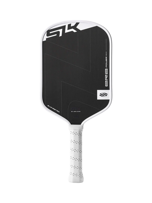 Elongated pickleball paddle with dark face, white frame, and speckled white grip