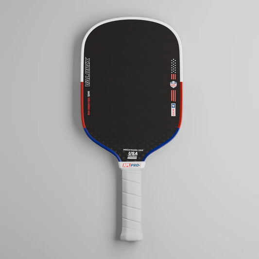 Black pickleball paddle with blue edge, white grip, and red accent strip