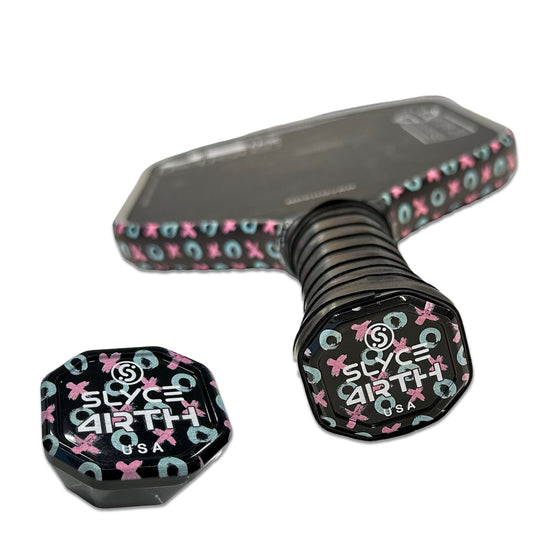 Pickleball paddle SpeedCap enhancer set with black cap and pink/blue graphic trim